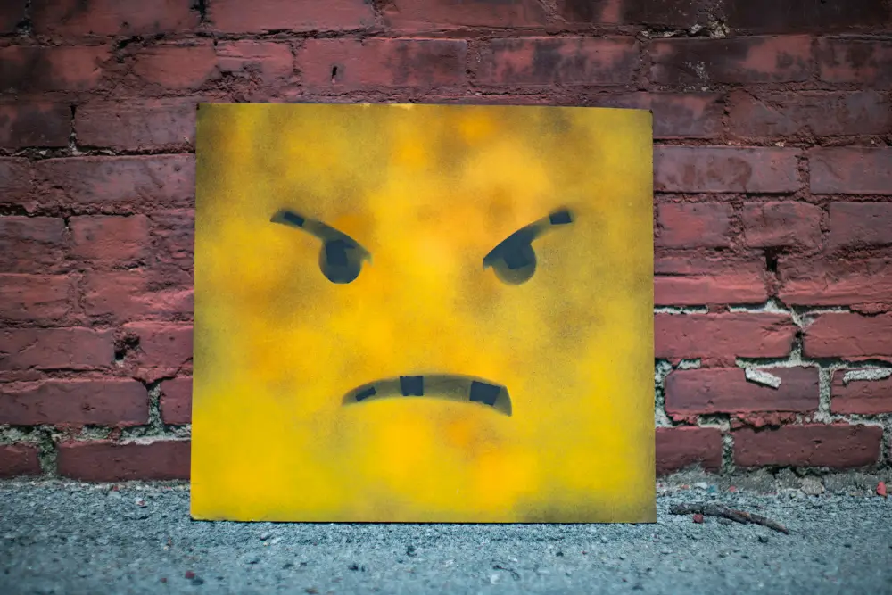 painting of an angry smiley face
