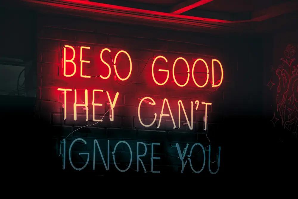 neon sign that says 'Be so good they can't ignore you'