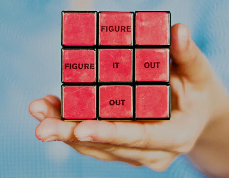 Rubix cube with 'figure it out' written on it